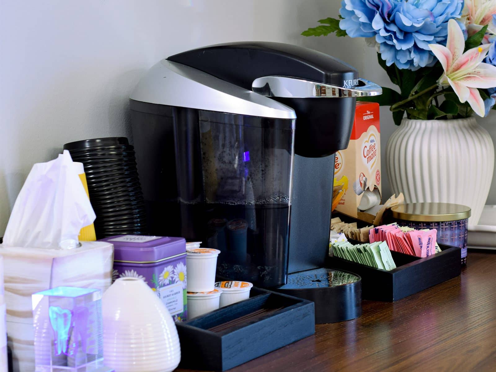 The complimentary coffee and beverage station in the waiting area