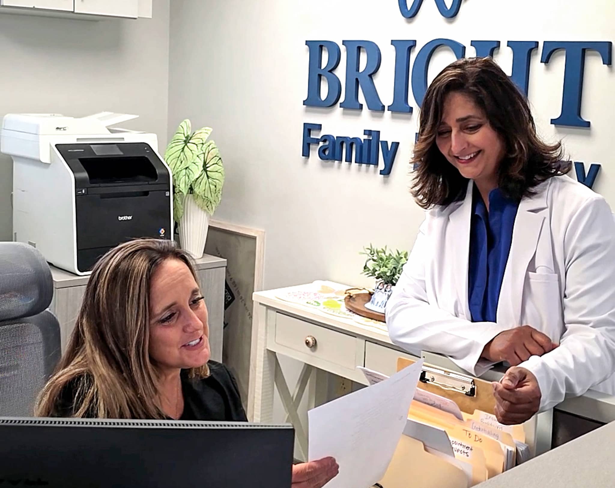 Reviewing patient files at the front office