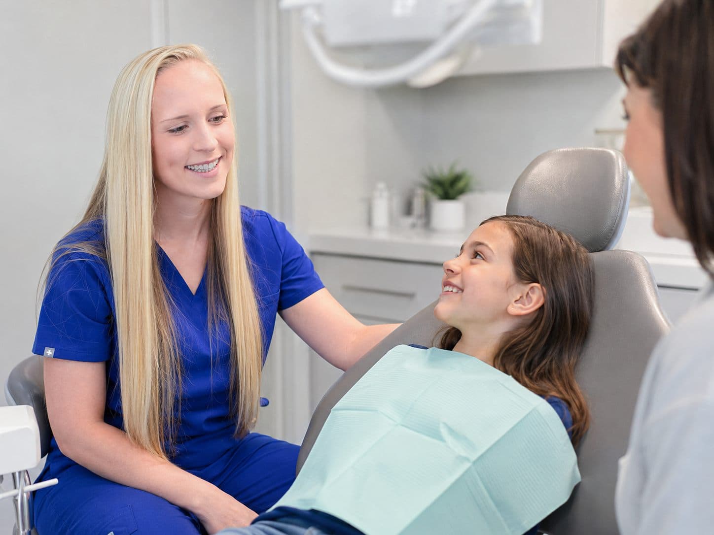 A child smiling during a dental checkup